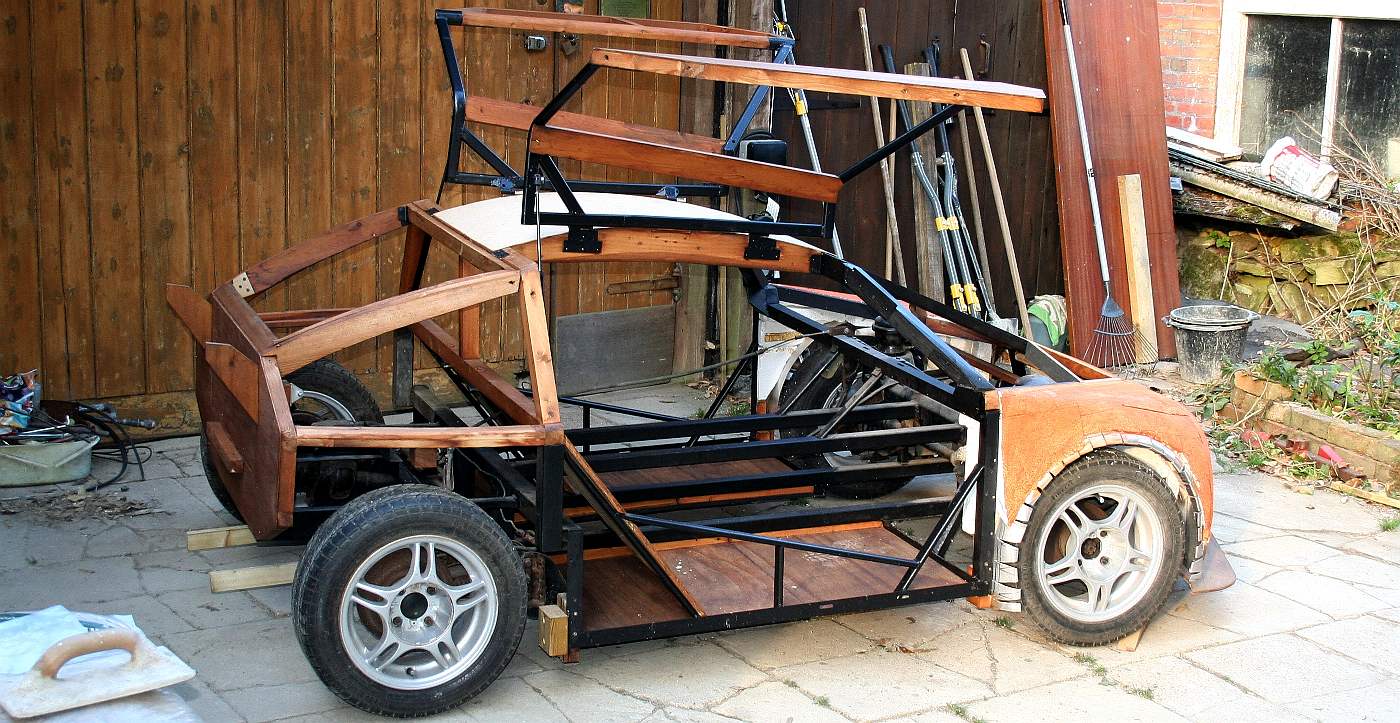 Hydrogen powered fuel cell sports car, with gull wing doors.